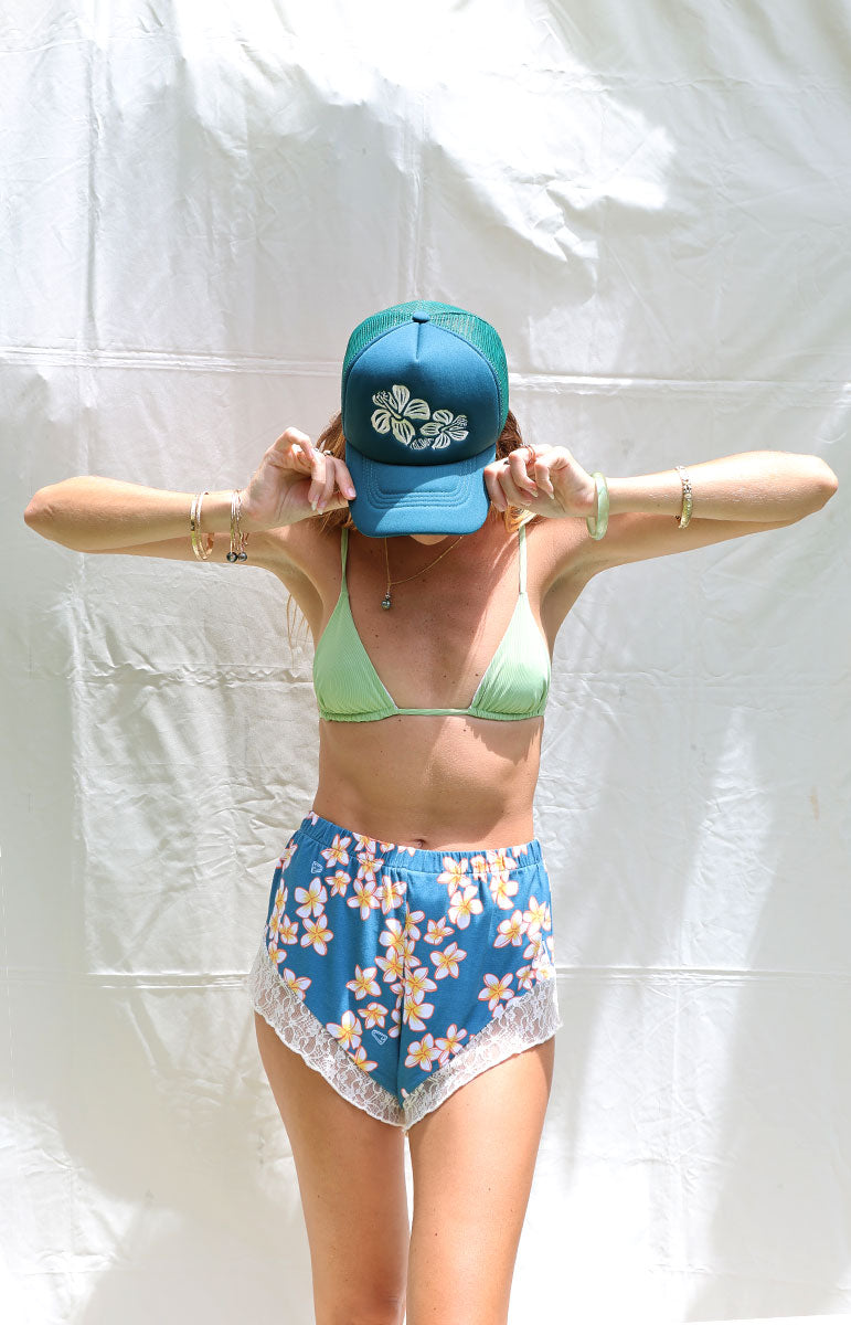 tai swim co embroidered trucker foam hat from kailua oahu made from recycled materials with hand woven embroidery local beach girl hat from hawai'i in kailua shop keiko collaboration with adjustable strap and back mesh matching bikini colors