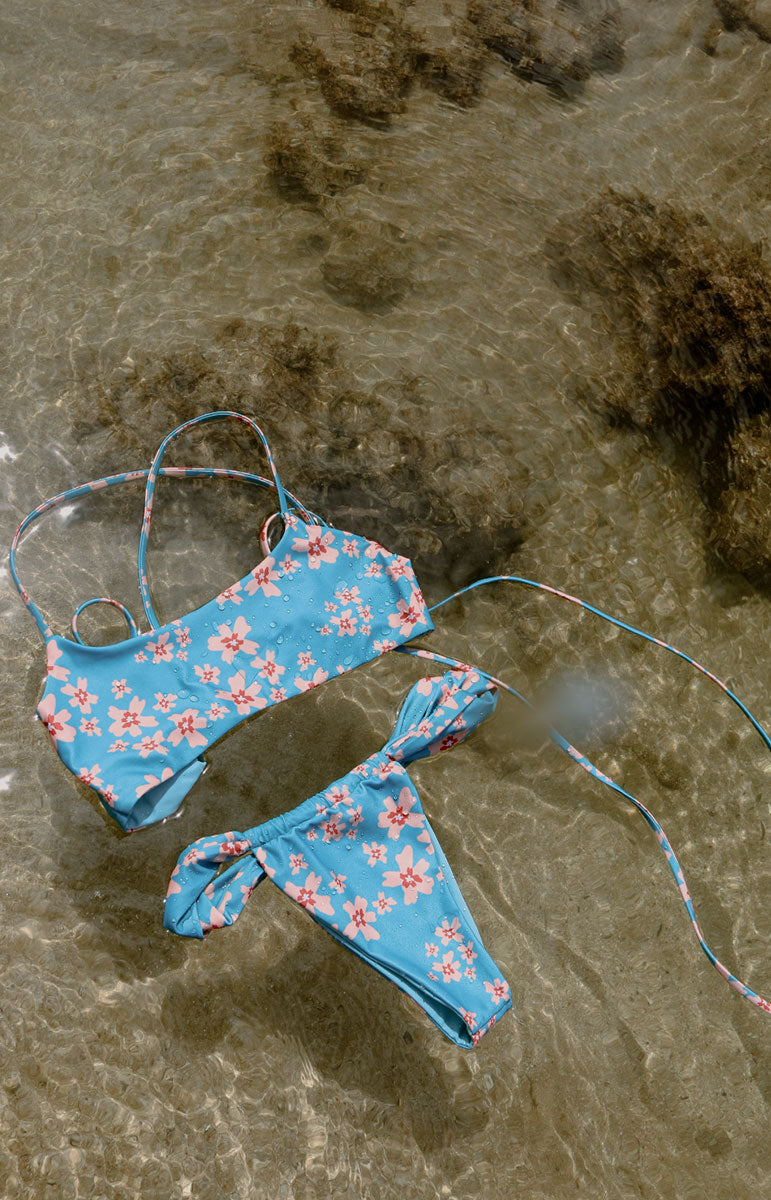 tai swim co starr set in blossom sakura pink floral cheeky sustainable repreve fabric thong bikini bottom with thick straps and adjustable strings