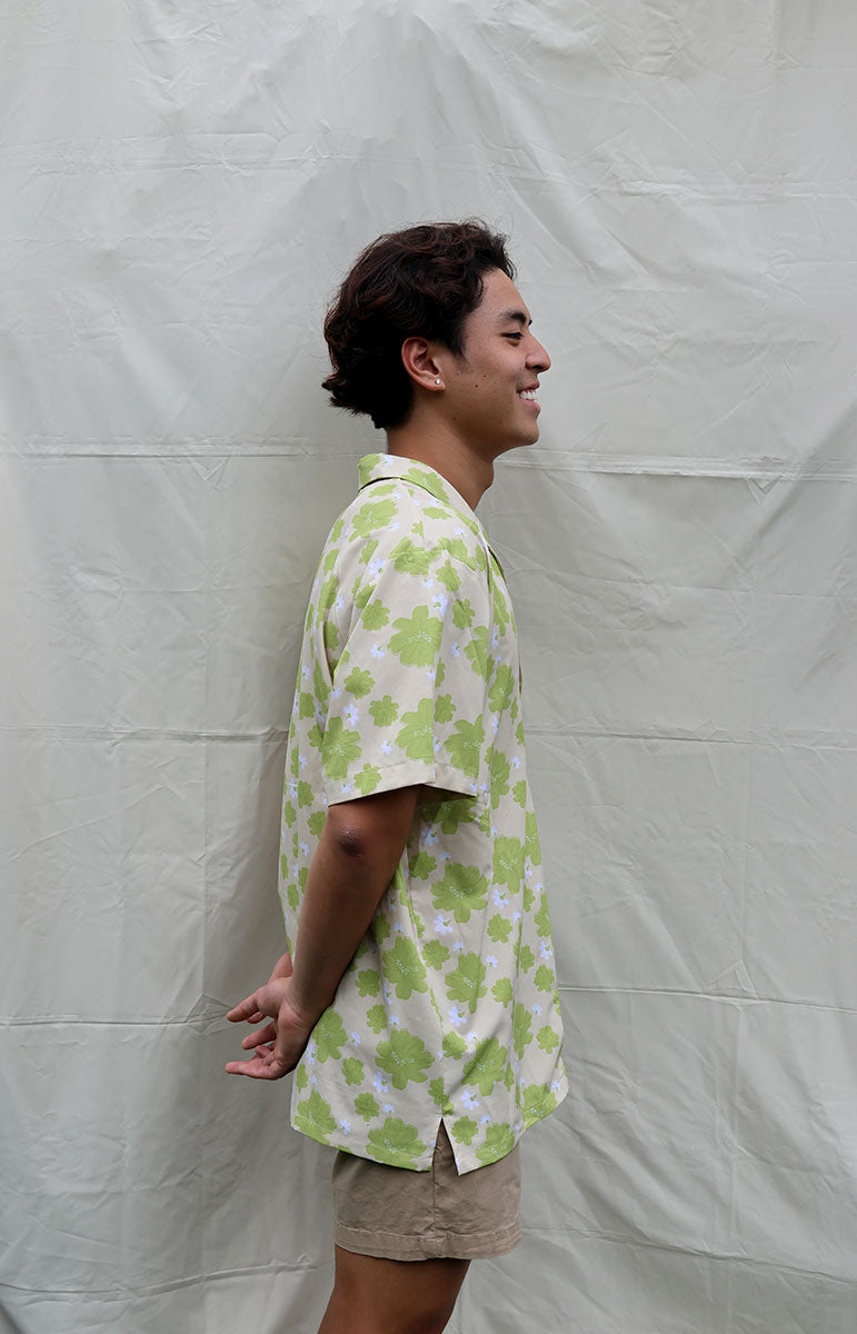 tai swim co braden shirt in kahakai naupaka kahakai green hawaiian floral hand drawn print on a linen breathable shirt with wood buttons and comfy easily washable comfy shirt made in hawaii locally kailua oahu kailua bikinis and matching shirts tai swim co spring bikini prints and clothing