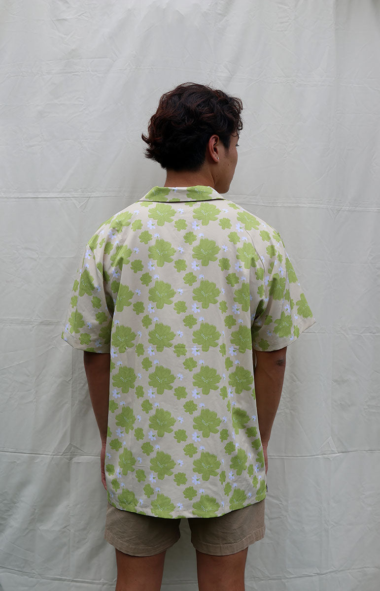 tai swim co braden shirt in kahakai naupaka kahakai green hawaiian floral hand drawn print on a linen breathable shirt with wood buttons and comfy easily washable comfy shirt made in hawaii locally kailua oahu kailua bikinis and matching shirts naupaka plant floral pattern