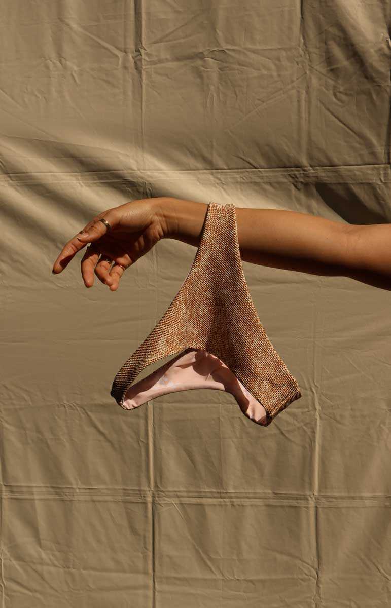 tai swim co hoku long sleeve surf suit from oahu kailua hawaii animal print gold snake print abstract bikini from kailua bodysuit