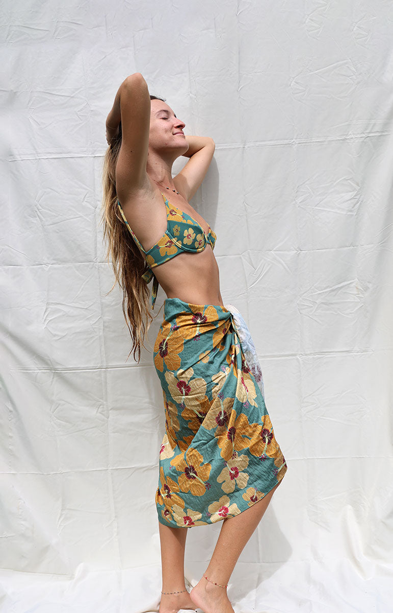 tai swim co coco sarong in milo flower from native hawaiian plant tree inspired by hawaii tai swim co hawaiian floral beach sarong cover up from kailua windward side oahu local bikinis made from sustainable materials oversized large beach blanket beach cover up in hawaii