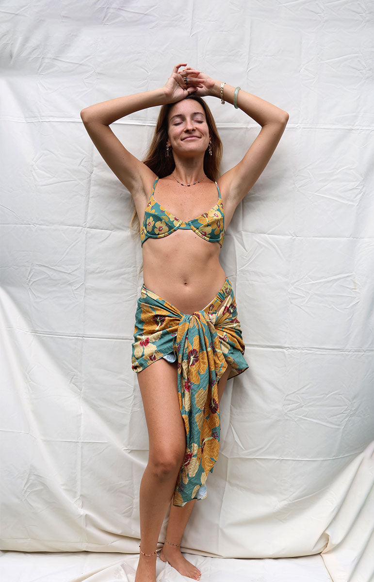 tai swim co coco sarong in milo flower from native hawaiian plant tree inspired by hawaii tai swim co hawaiian floral beach sarong cover up from kailua windward side oahu local bikinis made from sustainable materials oversized large beach blanket beach cover up in hawaii