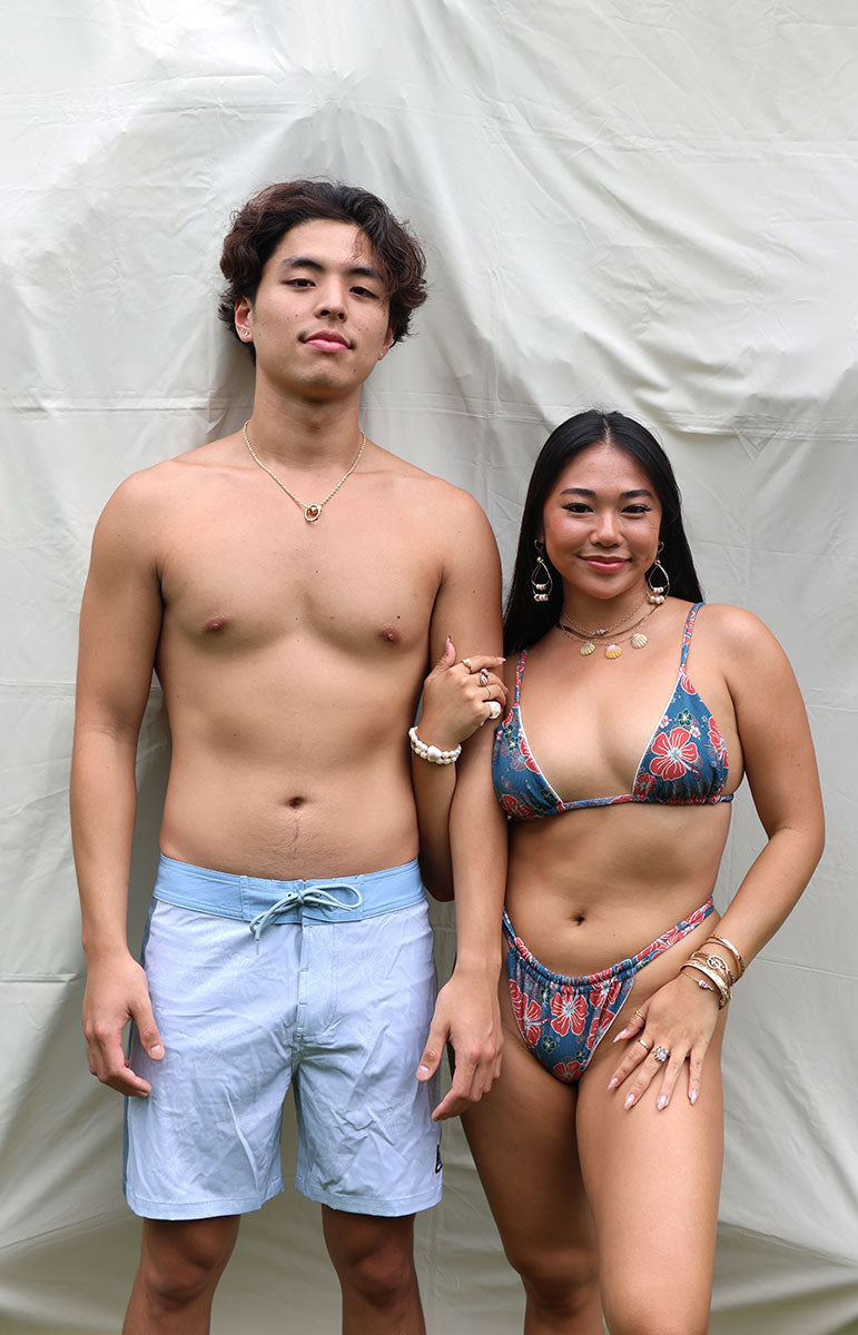 tai swim sustainable men's boardshorts gavin swimwear trunks in tonggs blue floral hibiscus print swimwear boardshorts for guys and girls with tai swim logo patch detail made in hawaii designed in kailua oahu hawaii hidden print sustainable eco friendly boardshorts from windward side oahu matching swimwear and boardshorts eco friendly vissla style surf shorts with drawstring and pocket kahala matching with tai swim bikinis