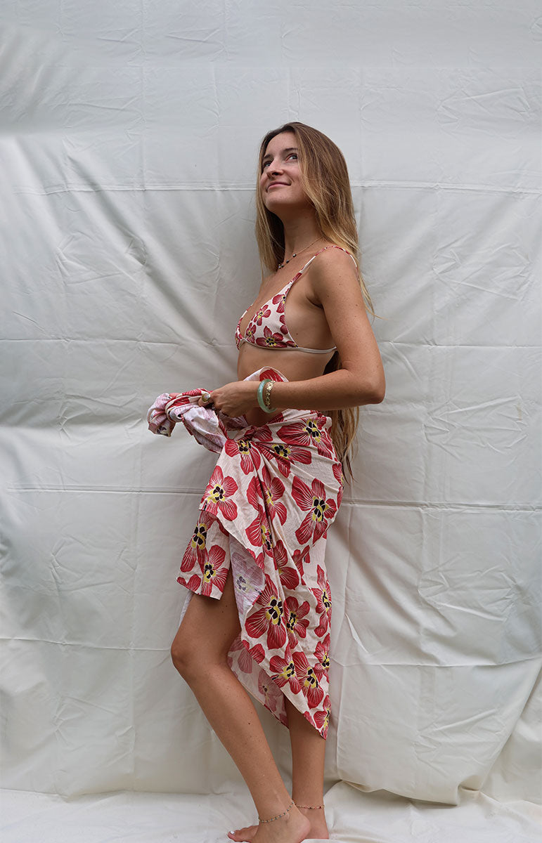 tai swim co coco sarong in haena hau floral pink and light white pink floral hawaiian flower on a beach cover up oversized pareo in silky lyocell fabric with matching bikini flower assortment silky hawaiian beach cover up from kailua oahu pareu single sided printing