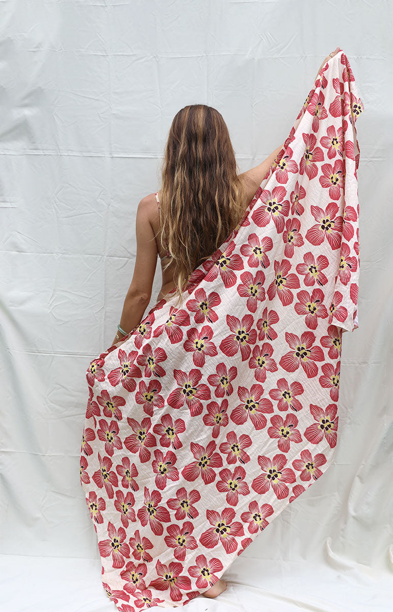 tai swim co coco sarong in haena hau floral pink and light white pink floral hawaiian flower on a beach cover up oversized pareo in silky lyocell fabric with matching bikini flower assortment silky hawaiian beach cover up from kailua oahu pareu