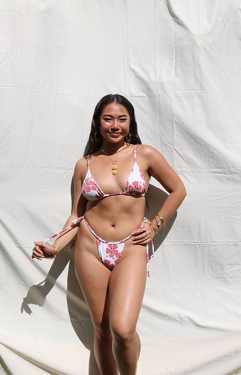 tai swim co joelle top triangle skimpy adjustable bikini from oahu hawaii sustainable material materials handmade in Kailua Oahu Hawaiian model with dark hair with jewelry on a sunny day skimpy adjustable Hawaii bikini top and bottom in ribbed textured comfy size inclusive material from the Hawaiian islands triangle tops