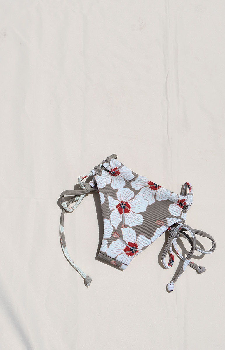 Tai Swim Co Keiki swim set in Kailua print featuring a full-coverage tie-side bikini bottom and matching tie-back top, displayed flat on a neutral background made with sustainable eco friendly materials reversible cute skimpy kids bikini