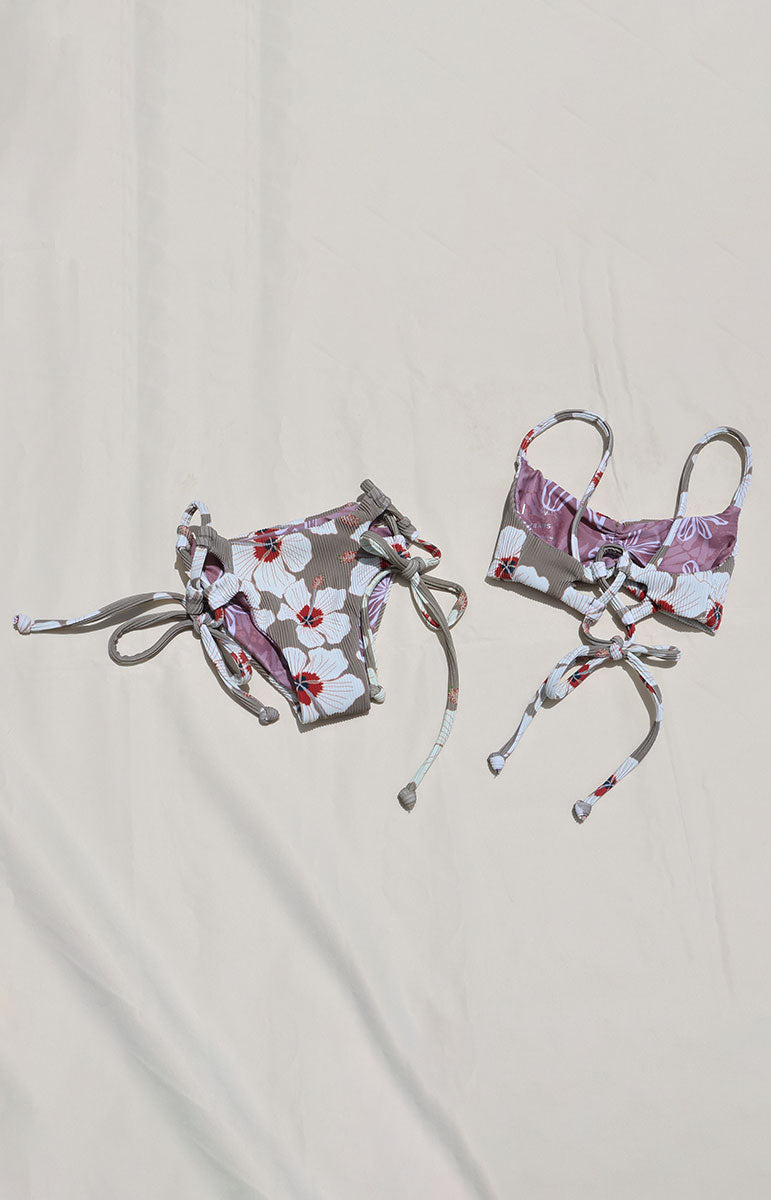 Tai Swim Co Keiki swim set in Kailua print featuring a full-coverage tie-side bikini bottom and matching tie-back top, displayed flat on a neutral background made with sustainable eco friendly materials reversible cute skimpy kids bikini
