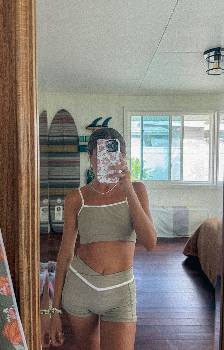 tai swim co kylie top and shorts in chai sustainable eco friendly workout gear from oahu kailua hawaii ribbed light tan materials with triangle wave white logo tai swim co branding kailua oahu hawaii piping two tone ribbed bikini material workout sets kailua oahu hawaii