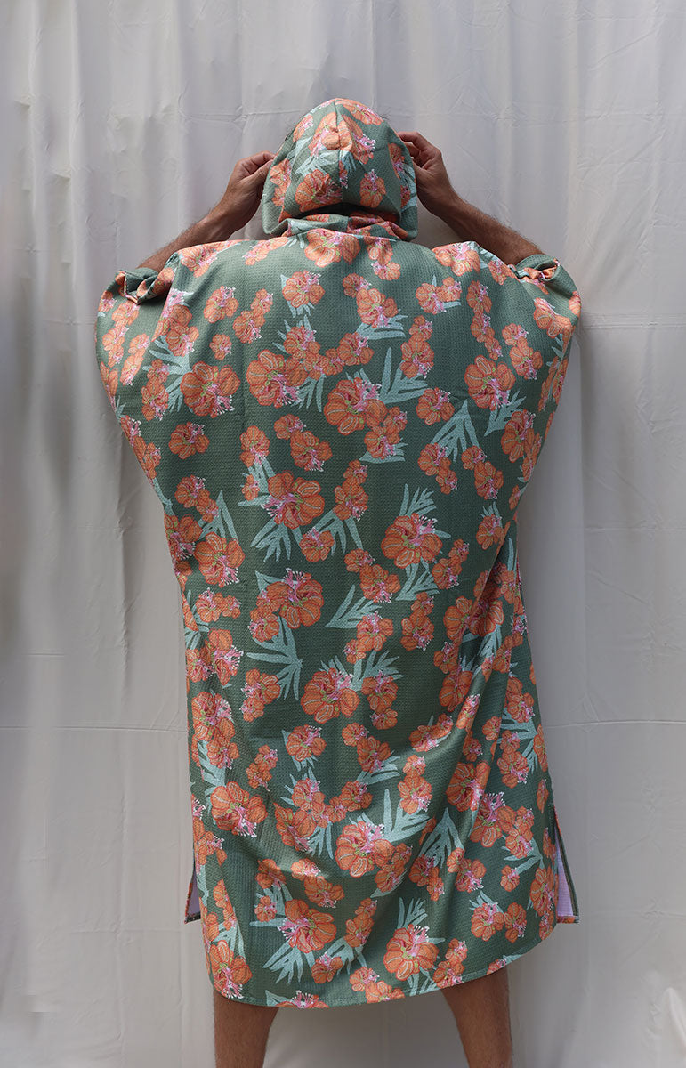 tai swim waikoloa orange and green wiliwili flower changing surf poncho made from recycled waffle terry microfiber hooded towel for tall guys comfy snuggie quick drying towel from oahu hawaii kailua local hawaiian accessories from hawaii slit in the side fits all heads