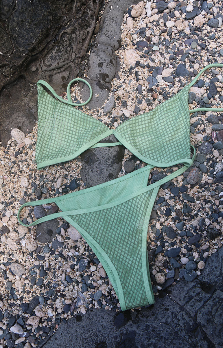 tai swim co mina top in sage crochet mesh green netting fishing net eco friendly recycled bikinis from oahu hawaii cheeky thong minimal coverage summer swimsuits and swimwear size inclusive ocean friendly swim on sandy lava rock hawaii photography pinterest