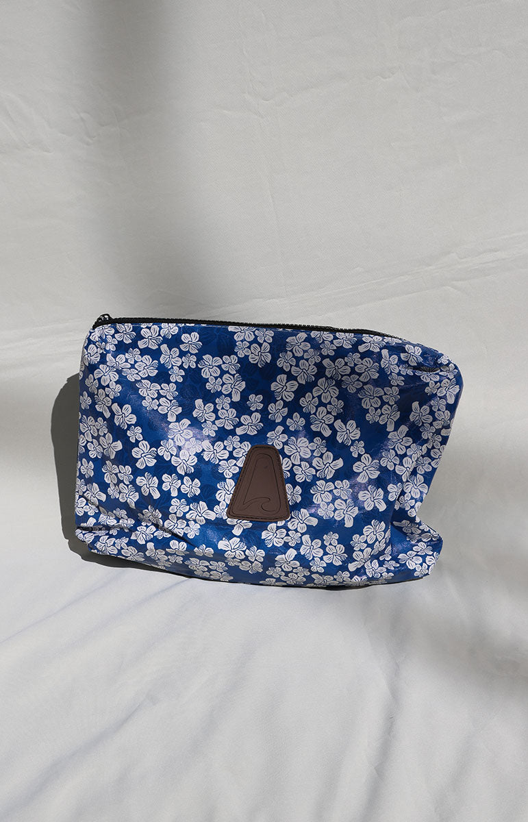 Hanakini white and Blue floral-patterned pouch on a white background