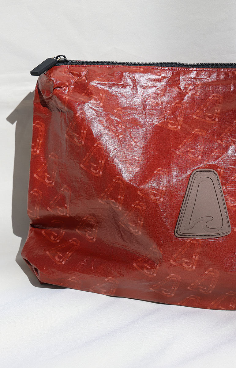 Red tyvek logo tai swim triangle wave logo pouch with a zipper on a white background logo pattern double lined bag
