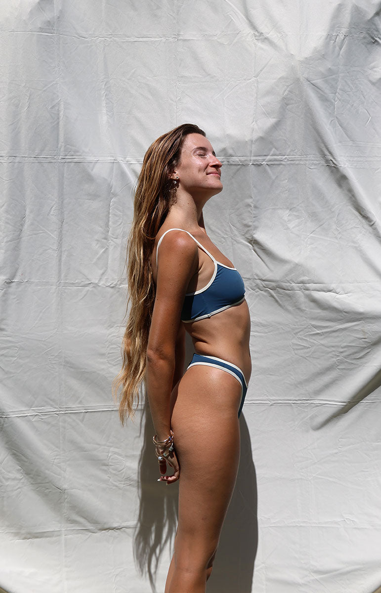 tai swim co quinn top in rift blue dark piping border bikini with sporty scoop neck style tank top for swimming and surfing in hawaii with sporty piping cheeky high waisted bottom in hawaii