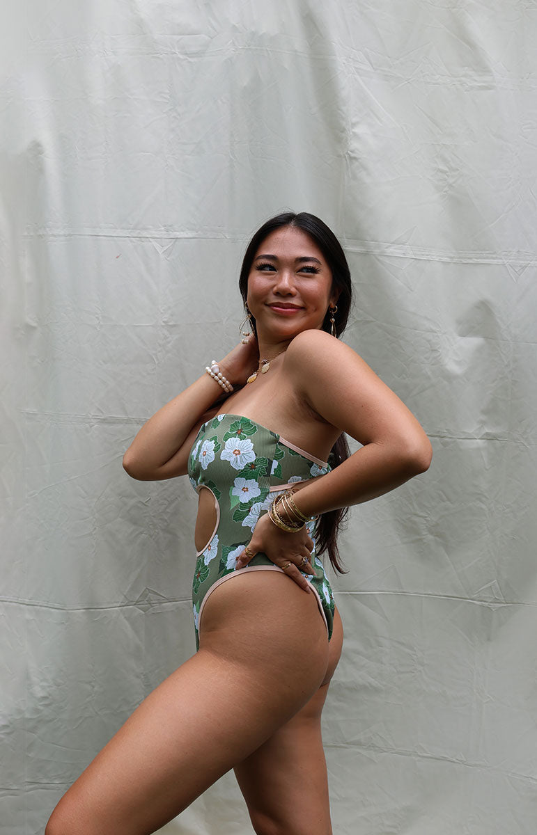 tai swim co sarah one piece from oahu kailua hawaii green and white pikake floral hawaiian swimwear print with retro sporty piping and green leaves with a vintage silhouette and reversible lining with tie in the back sustainable swimwear from hawaii