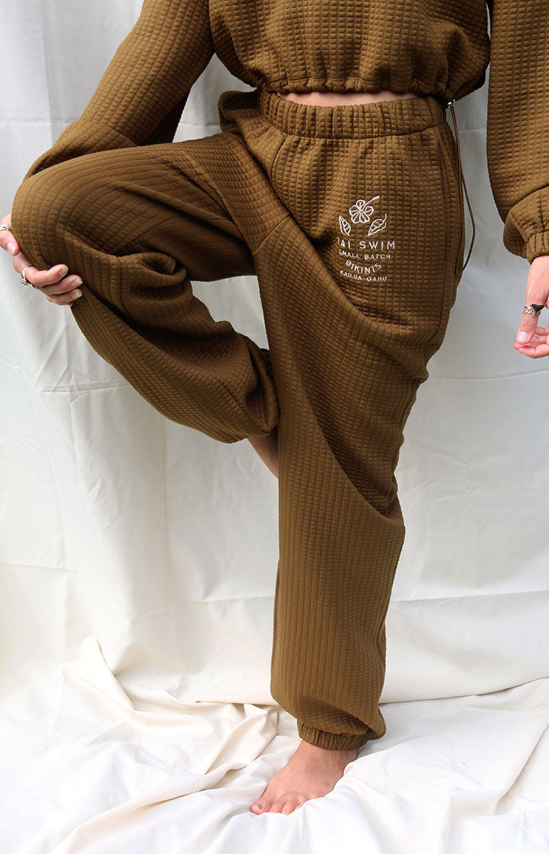 shaiann sweatpants in espresso lounge brown waffle textured beach cozy matching sustainable sets scrunchy waistband and oversized fitting sweatpants with matching crop top from kailua oahu hawaii made from sustainable repreve fabric