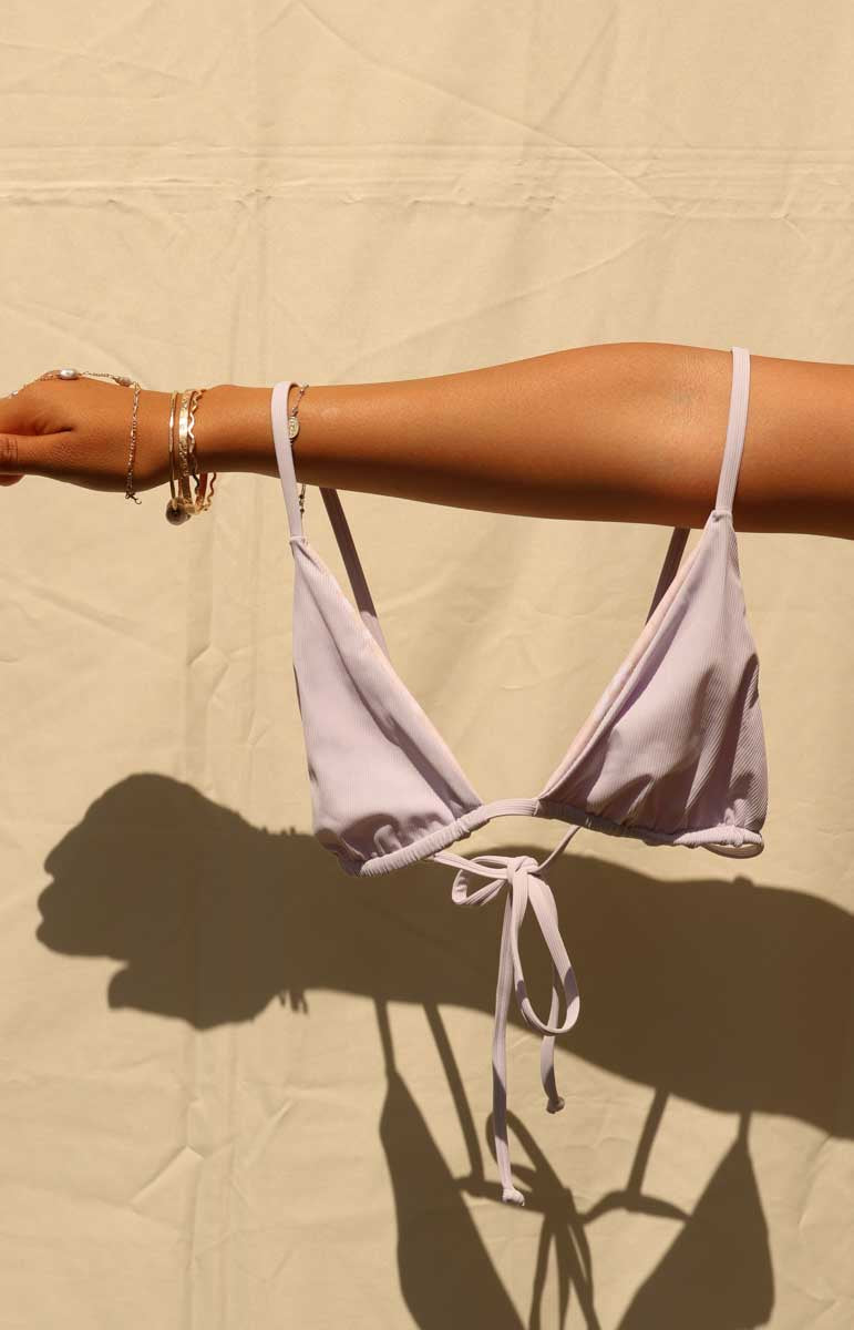 tai swim co devin bottom paired with a joelle top in poni purple triangle bikini top in light lavender pastel
