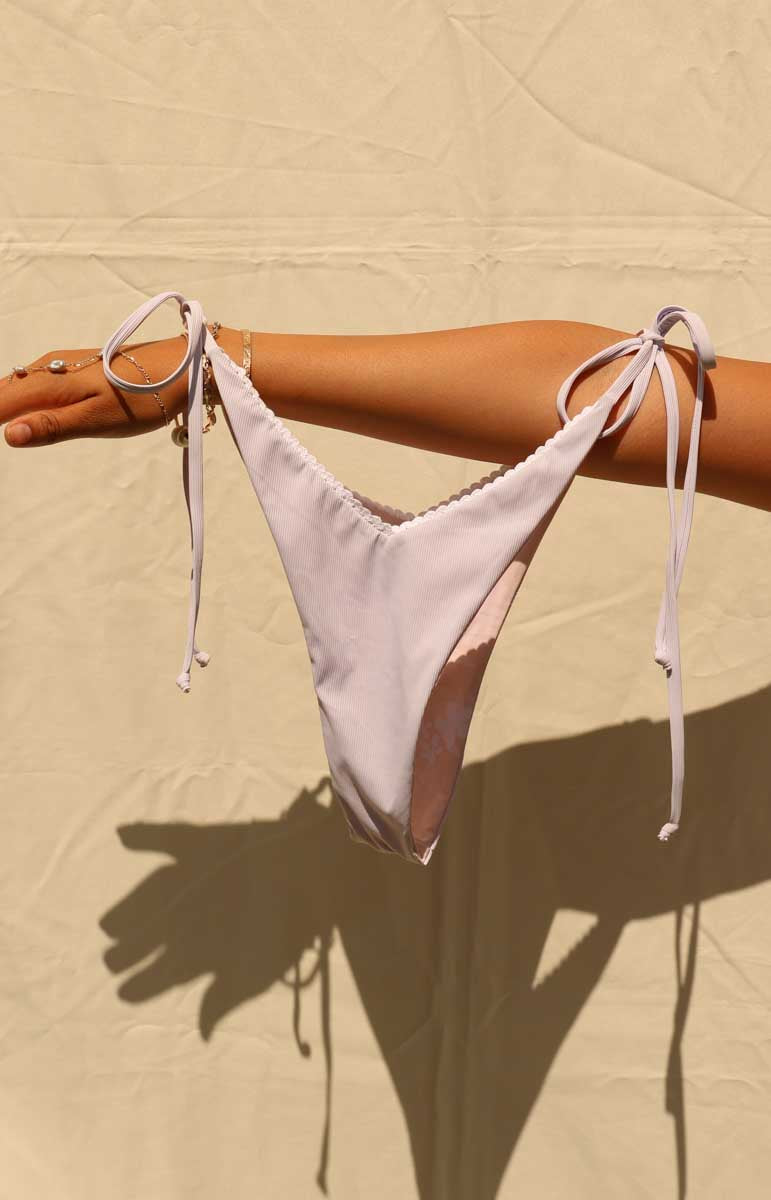 tai swim rhia bottom in poni lavender purple with ties in the back and skimpy coverage