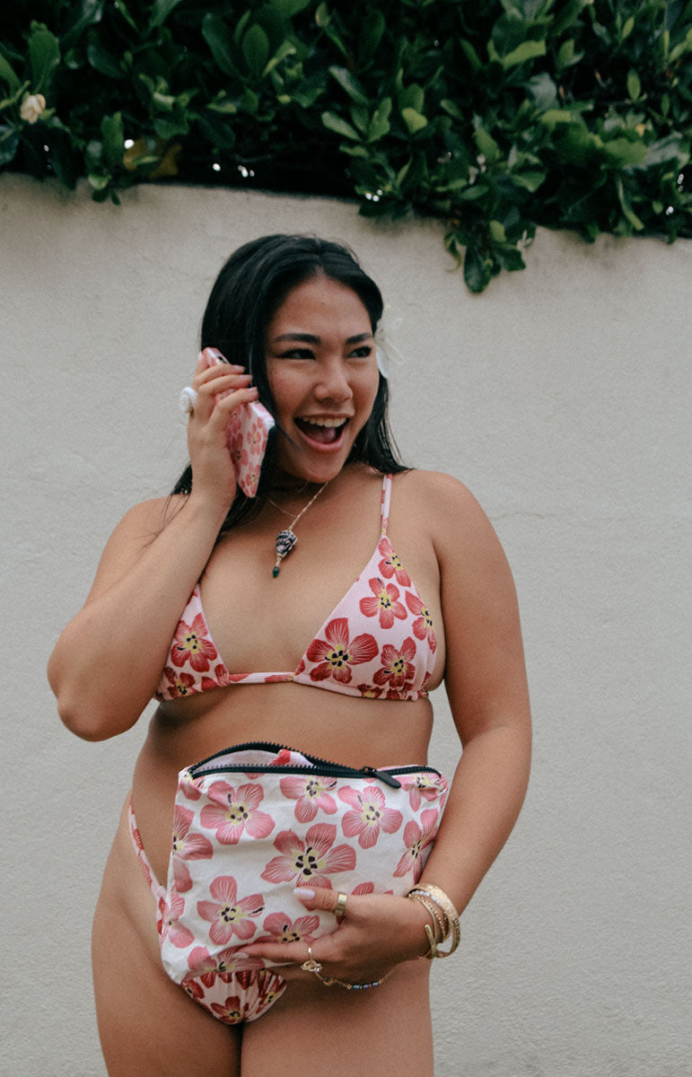 tai swim co haena recycled tyvek matching hau tree flower hand drawn floral design pink maroon flower print design matching sustainable small batch bikinis in a small splash proof beach bag for phone wallet and keys