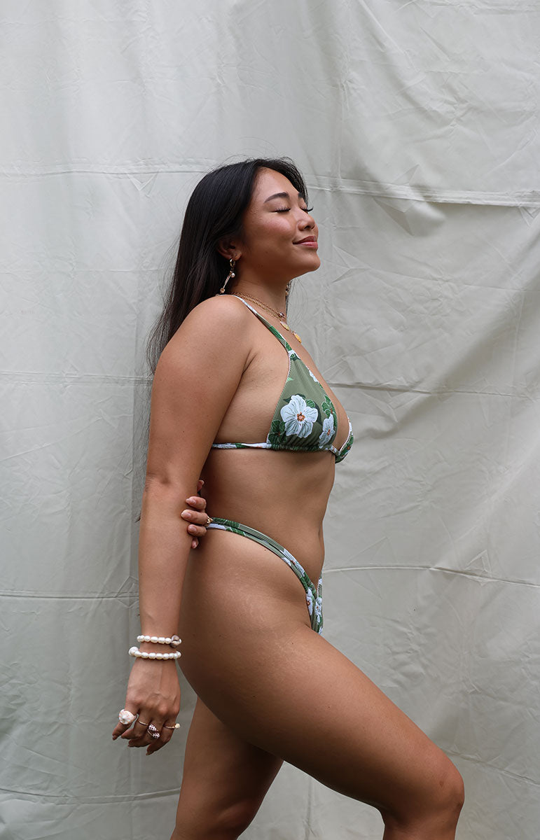 tai swim co joelle scrunchie two strap, thin, reversible, green white floral seamless stitching made in Hawaii Hawaiian designed high-rise minimal skimpy Joelle comfort swimwear, sustainable Hawaiian bottom by Tai Swim Co minimal coverage with triangle bikini top oahu hawaii bikinis local swimwear