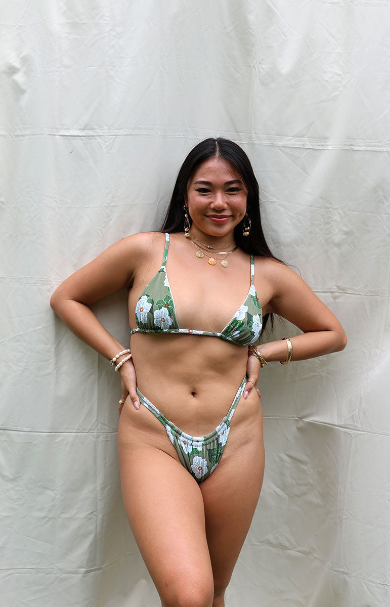 tai swim co joelle scrunchie two strap, thin, reversible, green white floral seamless stitching made in Hawaii Hawaiian designed high-rise minimal skimpy Joelle comfort swimwear, sustainable Hawaiian bottom by Tai Swim Co minimal coverage with triangle bikini top