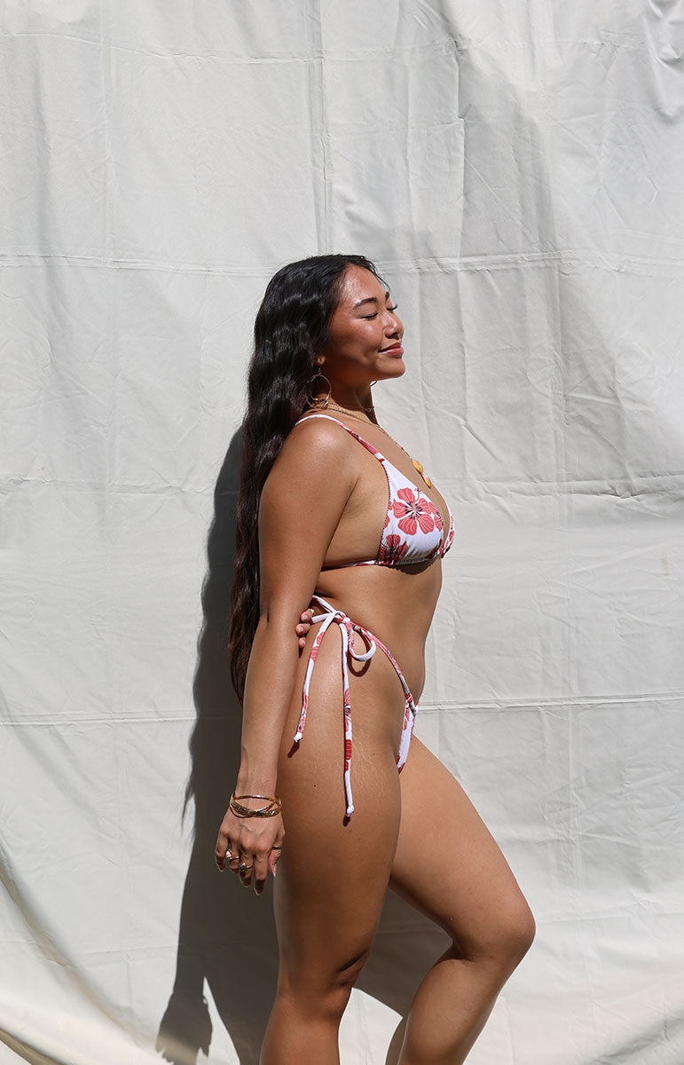 tai swim co joelle top triangle skimpy adjustable bikini from oahu hawaii sustainable material materials handmade in Kailua Oahu Hawaiian model with dark hair with jewelry on a sunny day skimpy adjustable Hawaii bikini top and bottom in ribbed textured comfy size inclusive material from the Hawaiian islands triangle tops