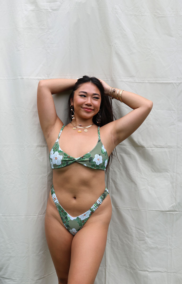 tai swim co kammi y scrunch garter v high leg cut bikini top and bottom strapps twist top and triangle silhouette minimal coverage bikini bottoms with trendy white floral green hawaiian flower thong bottom with shell jewelry