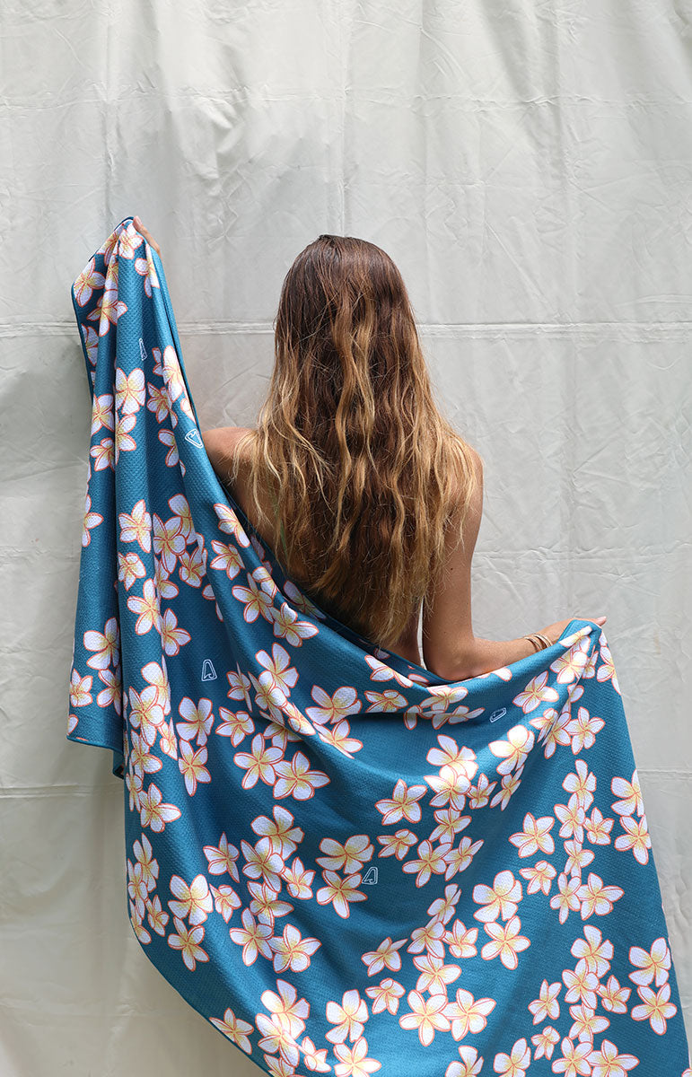 tai swim co shop keiko collaboration towels with blue and pink plumeria tropical hawaii flowers from oahu kailua hawai'i