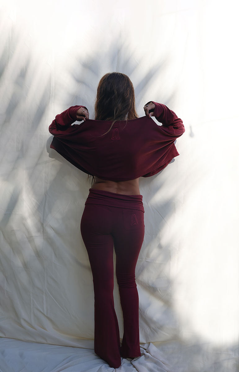 tai swim co cotton lounge shaiann top in rose burgundy maroon long sleeve top and flare pants made of organic cotton eco friendly materials
