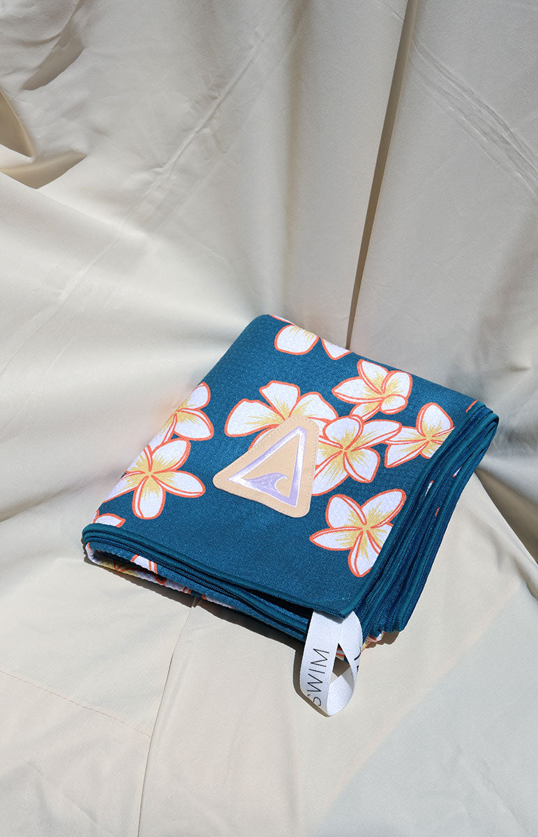 tai swim co shop keiko collaboration towels with blue and pink plumeria tropical hawaii flowers from oahu kailua hawai'i