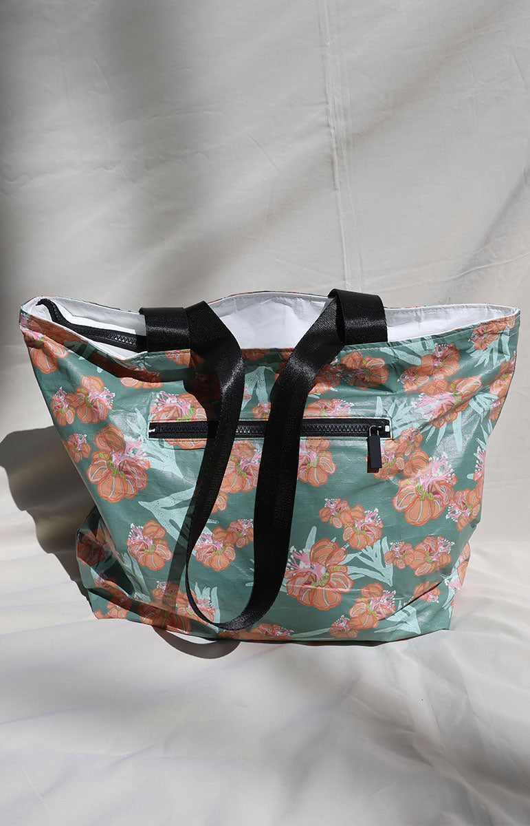 tai swim co zippered tote bag in waikoloa green orange floral hibiscus lauae pattern from kailua oahu hawaii tyvek waterproof bag