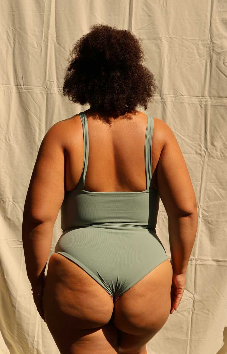 tai swim jordyn one piece in green fern ribbed cheeky sustainable bodysuit comfy material