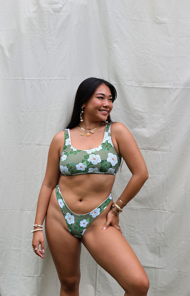 tai swim co mariah top sporty thick strap scoop neck bikini top with sporty straps and thong bottom in pikake flower green gardenia petals and hand drawn flowers