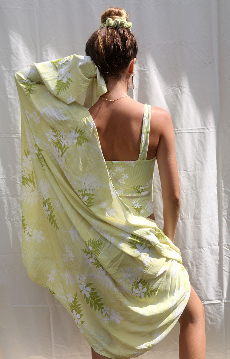 tai swim co coco sarong in hilo floral green yellow bikini print in comfy organic cotton recycled swimwear material cozy beach blanket moisture wicking hydrophobic recycled material pareo