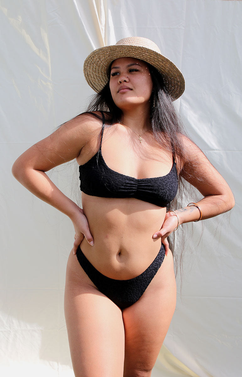tai swim co emma top in hiwahiwa black animal print bikini tops with sporty ruching on the back eco swimwear from hawaii