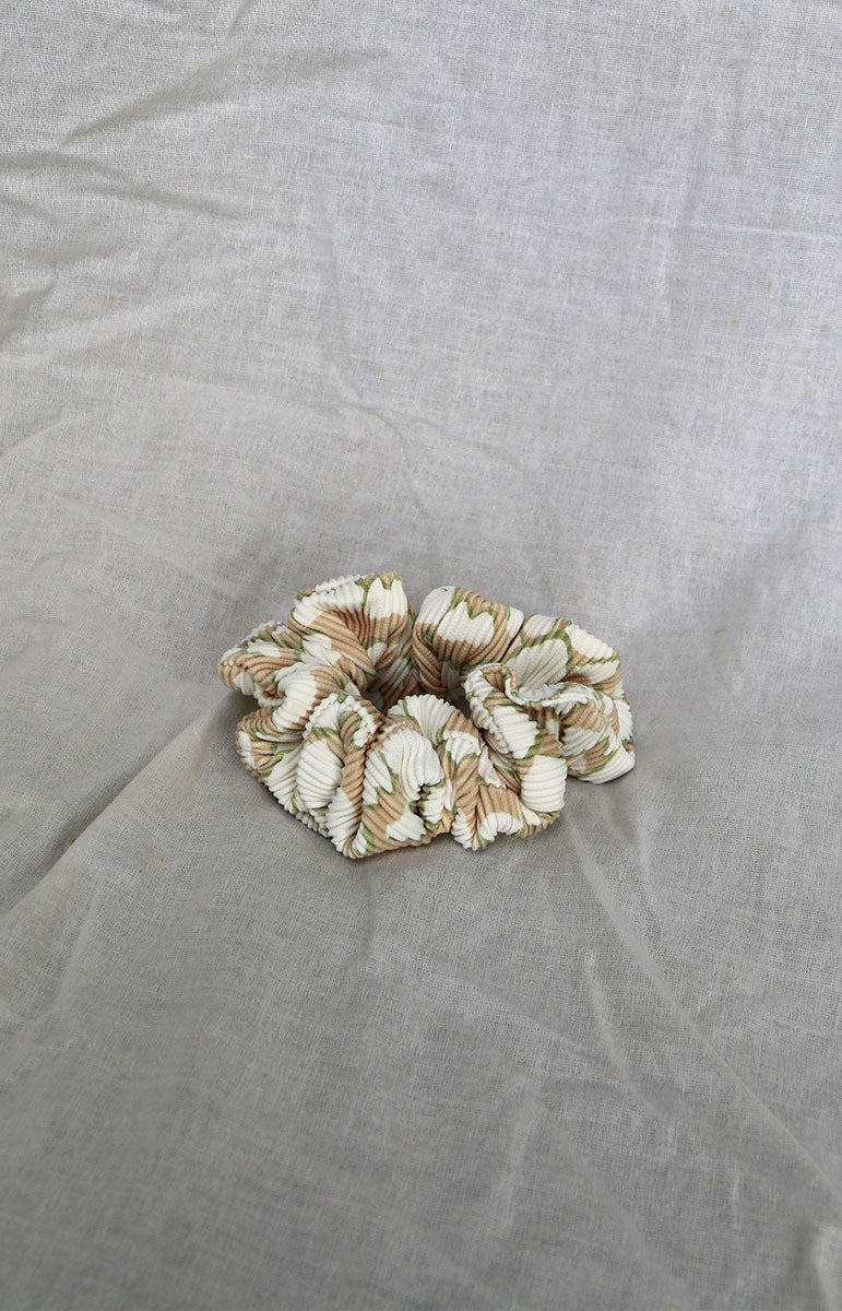 tai swim co matching sustainable scrunchie and ponytail holder made form recycled swimwear materials in hawaii conus shell print
