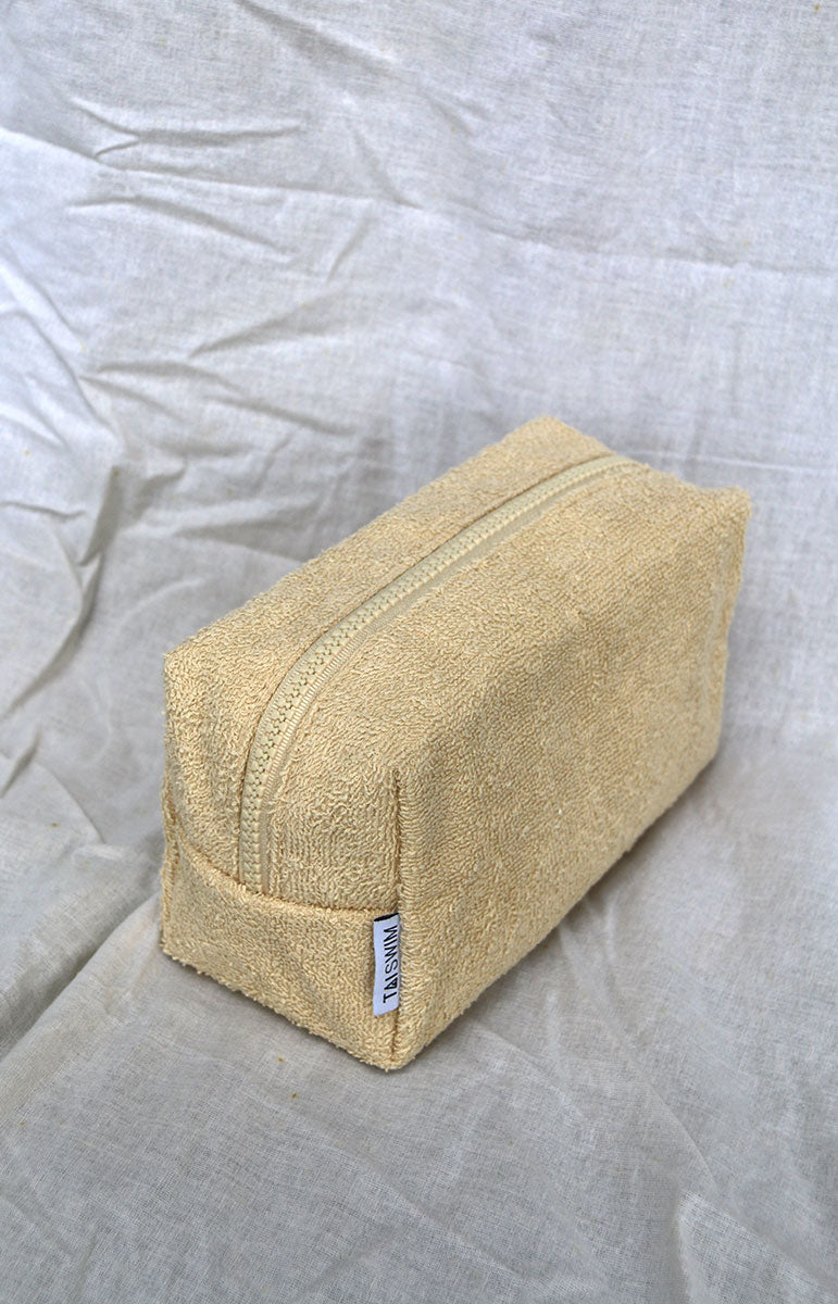 tai swim co zipper terrycloth bag with matching swimwear print on the inside gold zipper cosmetics vacation travel bag chai tan brown bag towel material