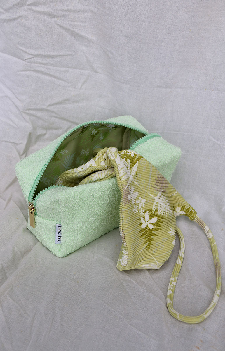 tai swim co zipper terrycloth bag with matching swimwear print on the inside gold zipper cosmetics vacation travel bag