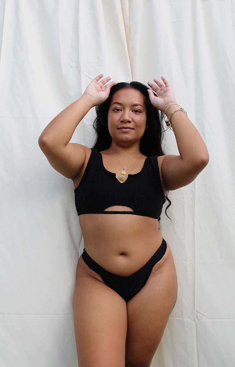 tai swim co tyler top in hiwahiwa textured black animal print swimwear black animal print textured lifted fabric made from recycled plastic water bottles in hawaii size inclusive plus size swimwear styles